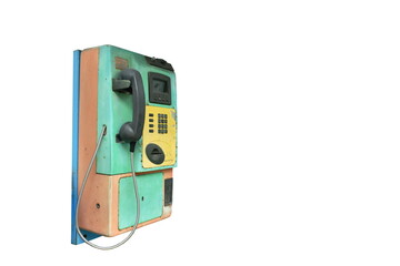 Fototapeta premium old and obsolete public telephone booth used by insert boin or card on white background