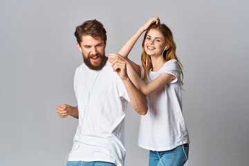 young couple in white t-shirts friendship fun modern style