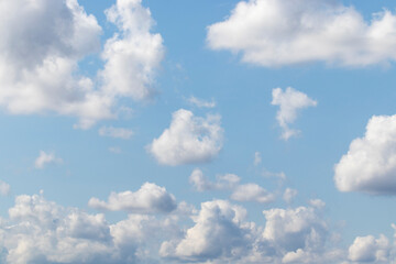 White fluffy clouds on a blue sky.