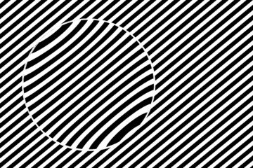 Magnifying lens against black and white stripes creating illusion of refraction of light