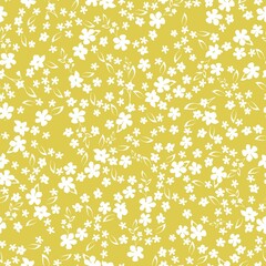 Seamless vintage pattern. the ornament is white flowers and leaves on a yellow background. vector texture. trend print for textiles and wallpaper.