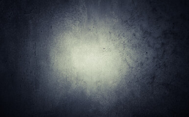 Obraz premium Dark gray blue textured concrete background with bright center light spot . Abstract texture for graphic design or wallpaper