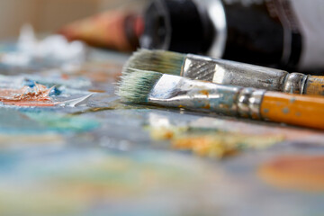 Row of artist paint brushes closeup