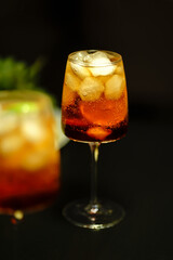 cocktail with ice on a dark background