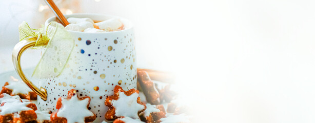 Christmas hot drink chocolate with marshmallows, spices and cinnamon in a mug close-up banner, copy space