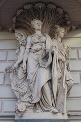 statue of three woman in the city