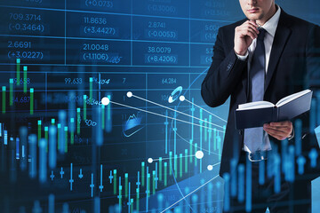 Businessman wearing formal suit is holding and reading a book
