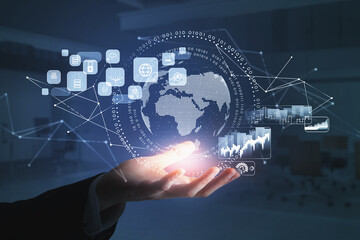 Businessman wearing formal suit is holding digital interface with globe