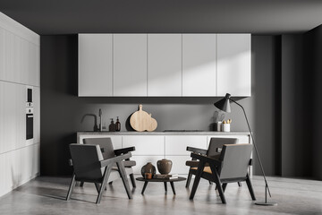Seating area with simple kitchen in grey
