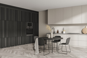 Corner of modern minimalist beige kitchen with dark wood area