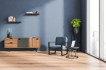 Living room interior with panoramic window and blue armchair