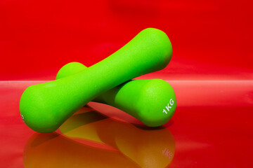 Green weights for sports one kilogram. Sports, 