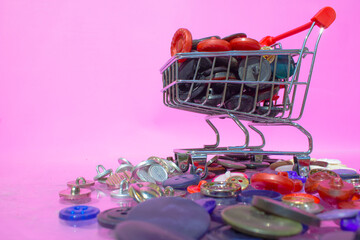 A supermarket trolley with various buttons in it. 