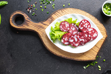 sausage meat with pieces of bacon beef or pork smoked or dry-cured meal snack on the table copy space food background rustic. top view