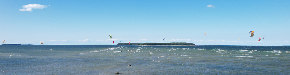Aerial view of kiteboarding on Baltic Sea. Salmistu beach in Estonia is a popular spot for kite...