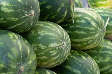 close-up watermelon stacked in a row