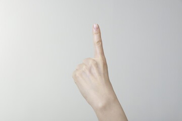 Close-Up Of Cropped Hand Pointing Finger