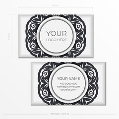 White business cards with vintage ornaments. Business card design with monogram patterns.