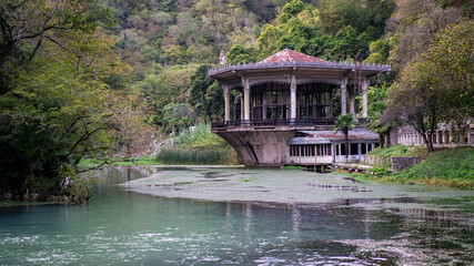 Abandoned railway station Psyrtsha in the middle of the lake in New Athos, Abkhazia