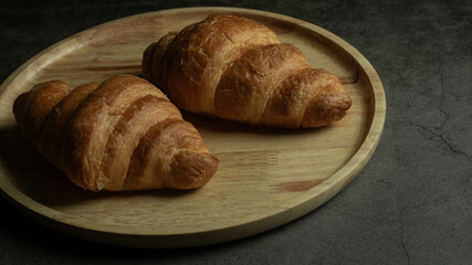 This is a picture of a croissant that has been eaten since the past.