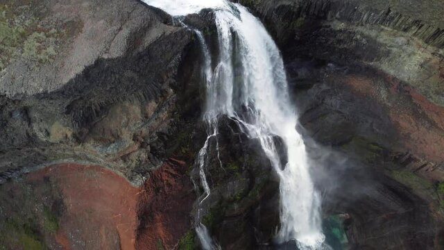 Hengifoss waterfall in iceland. Aerial drone video of Icelandic landscape. Famous tourist attractions and landmarks destinations in Icelandic nature on Iceland. 4K UHD video.
