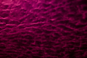 Abstract crimson colored background with textures of different shades of crimson red and purple