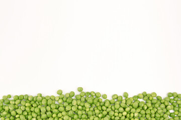Fresh green peas on a white background.The concept of growing and caring for agriculture, biology, agronomy, breeding, vegetarianism, protein production, sports nutrition. Copyspace
