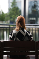 Fototapeta premium woman sitting on a bench