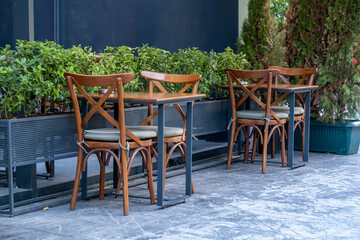 Fototapeta na wymiar wooden table and chair in roadside cafe garden