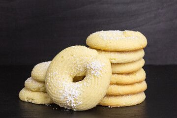 pile of homemade ring shaped lemon cream cheese cookies