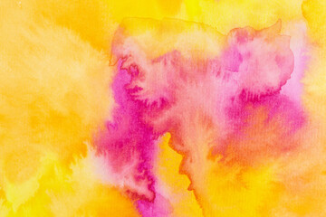 abstract watercolor background in shades of yellow, orange and pink