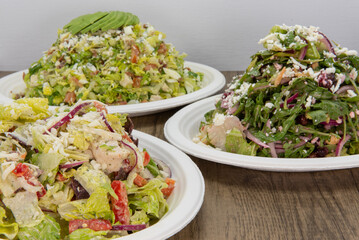 Caesar salad is front choices on this feasting table of meal choices to fill your appetite