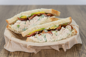 Chicken salad sandwich loaded with all the good fixings and mayo to completely fill any appetite for a meal