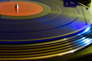 Blue Colored Vinyl Record Spinning On Stereo Turntable