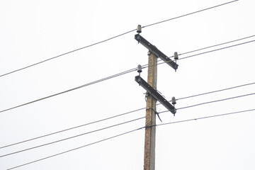 Electric post line with white sky