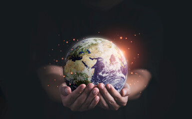 Man holding planet by two hands for earth day and saving energy environment concept ,Element of this image from NASA and 3d render. © Dilok