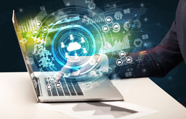 Business hand typing on a modern laptop