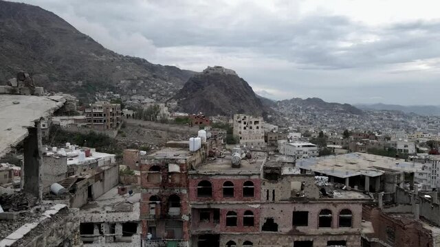 A drone scene of a war-damaged neighborhood in the city of Taiz 2021 