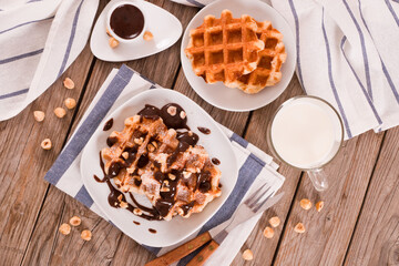 Waffles with chocolate cream and hazelnuts.