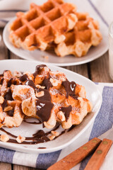 Waffles with chocolate cream and hazelnuts.