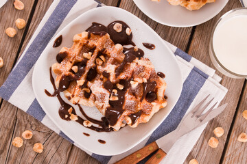Waffles with chocolate cream and hazelnuts.