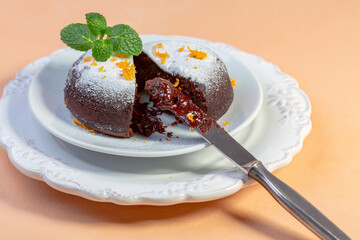 Chocolate cake with cocoa powder and orange peel.