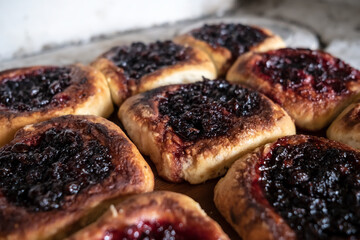 Delicious, mouth-watering homemade pies with berry filling, cooked in a Russian oven. Hearty, hot snack. Traditional cuisine.