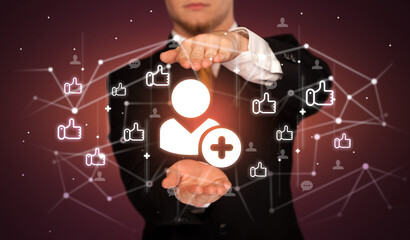 Hand holding social media icons