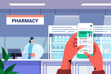 hands ordering medications on smartphone screen modern drugstore interior medicine healthcare concept