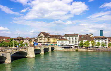Fototapeta na wymiar Panoramic view over turquoise Rhine river on a summer day in the centre of Basel, Switzerland