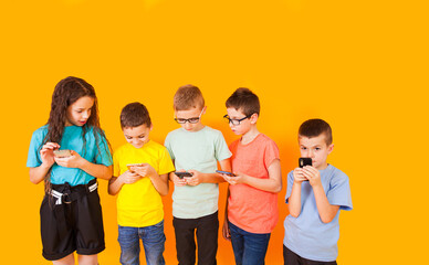 Young kids playing game on mobile phone