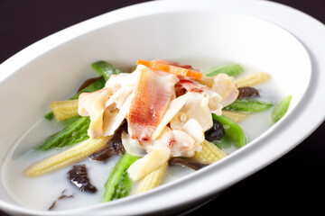 Delicious Chinese dishes, snail slices and vegetables in soup