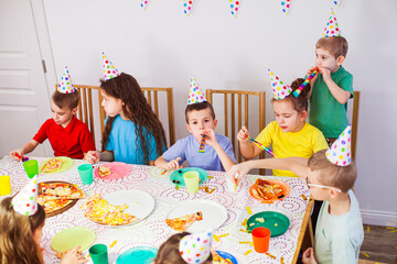 Kids celebrate together friend's birthday at home