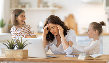 woman working on a laptop at home